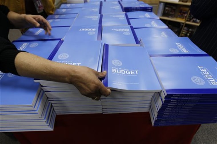 Copies of the U.S. Government budget for Fiscal Year 2012 are stacked up at the U.S. Government Printing Office in Washington, Monday, Feb. 14, 2011.(AP Photo/Alex Brandon)